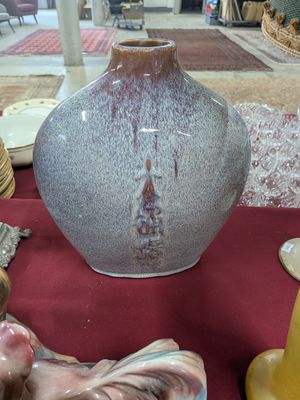 three vases that are sitting on a table