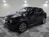 2018 nissan juke suv in a showroom with a checkered floor