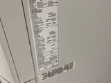 an lg washing machine with the door open and a label on it