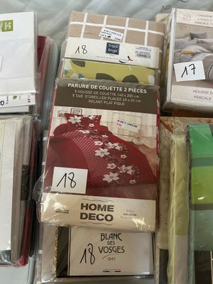 a lot of items that are on the bed