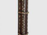 an image of a tall wooden pole with a decorative design on it