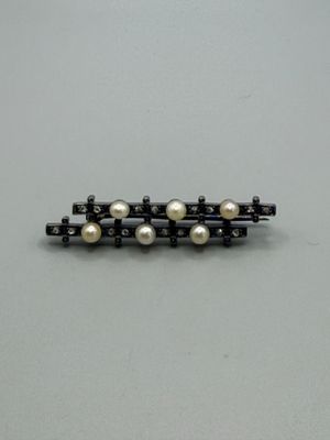 a close up of a pair of black and white pearls