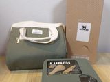 a lunch box and a lunch bag sitting on a table