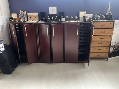 a room with a lot of drawers and cabinets in it