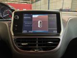 the dashboard of a car with a digital display in the center of it