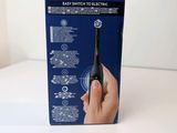 the box of the electric toothbrush is open on the table