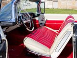 a red and white interior of a classic car
