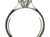 a close up of a ring with a diamond on top of it
