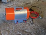an orange and silver blower sitting on the floor