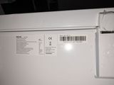 an image of a white refrigerator with a price label on it