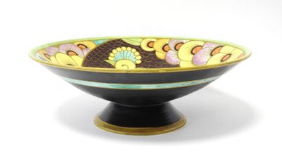 un bol noir orné d'un motif coloré