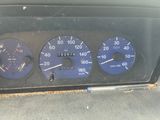 a close up of a car dashboard with various gauges