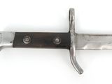 a knife that is laying on a white surface