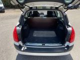 the back of a car with its trunk open in a parking lot