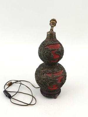 a lamp that is sitting on a table next to a cord