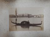 an old photo of a gondola on the water