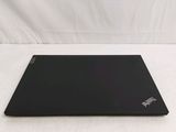 a black laptop on a white surface with a white background