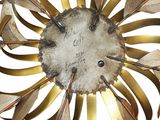 a clock that is made out of metal and gold