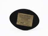 a label on the back of a black hat