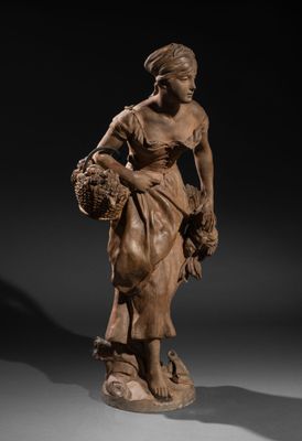 a statue of a woman holding a basket of flowers
