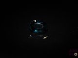 a close up of a blue glass ball on a black surface