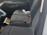 the interior of a van with the front seats folded down
