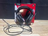 a pair of headphones sitting on a table next to a box