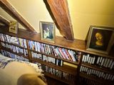 a picture of a bookshelf with a picture of a man on it
