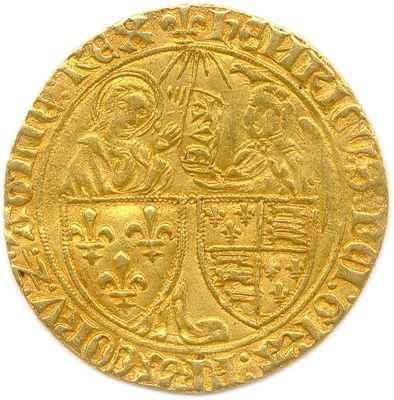 a close up of a gold coin with an image of a man on a horse