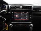 a car dashboard with a steering wheel and a key in it