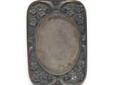 an antique silver plate with a floral design on the edge