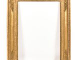 an antique gold frame with a white background