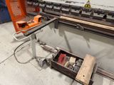 an image of a machine that is working on a piece of wood