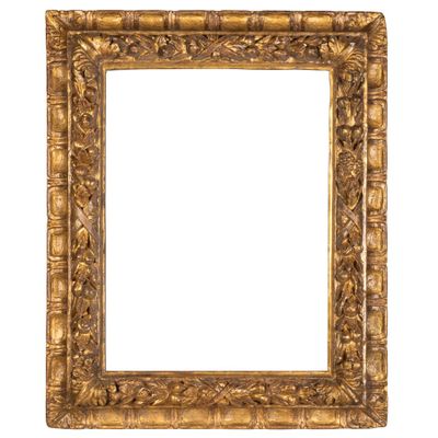 an old gold frame with a decorative pattern on a white background