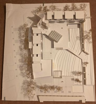 an aerial view of a model of a building on a table