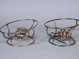 two small metal objects that are sitting on a table