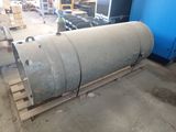 a large metal barrel sitting on a pallet in a warehouse