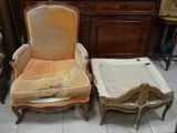 two chairs and a foot stool in a room