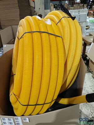 a box with a bunch of yellow hoses in it