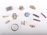 many different types of rings on a white surface