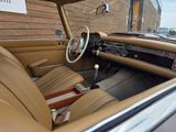 a car that is sitting inside of a car showroom