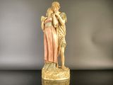 an image of a statue of a woman holding a child