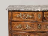 a marble top chest of drawers with a marble top on top
