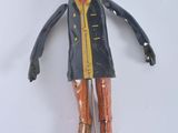 a figurine of a man wearing a hat and holding a cane