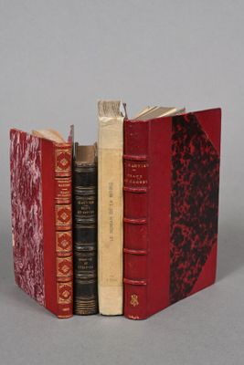 three books that are sitting on a table together