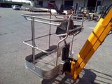 a crane that is sitting in the middle of a parking lot