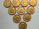 several gold coins are arranged in the shape of a heart