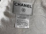 the label on the back of a chanel dress is clearly visible