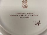 a white plate with a picture of a house on it