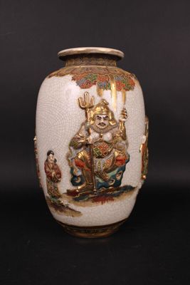 a white vase with a picture of a man on it
